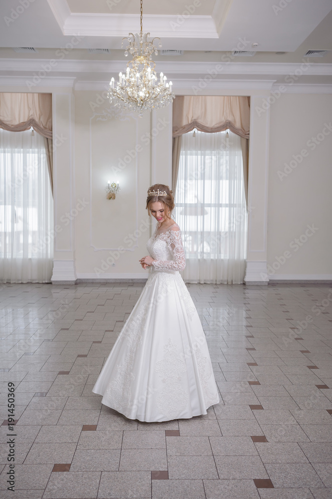 Beautiful bride in white interior