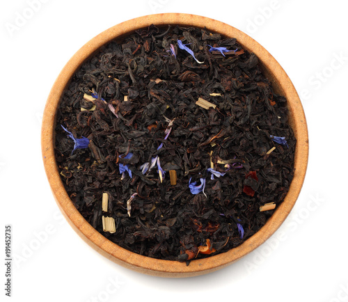 Aromatic black dry tea with petals isolated on white background top view