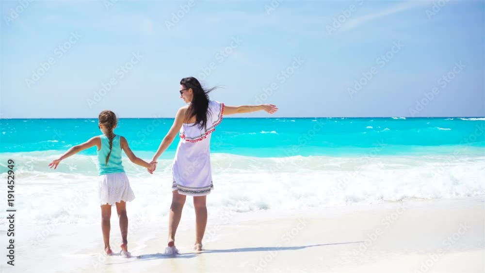 Beautiful mother and daughter on Caribbean beach Beautiful mother and daughter on Caribbean beach