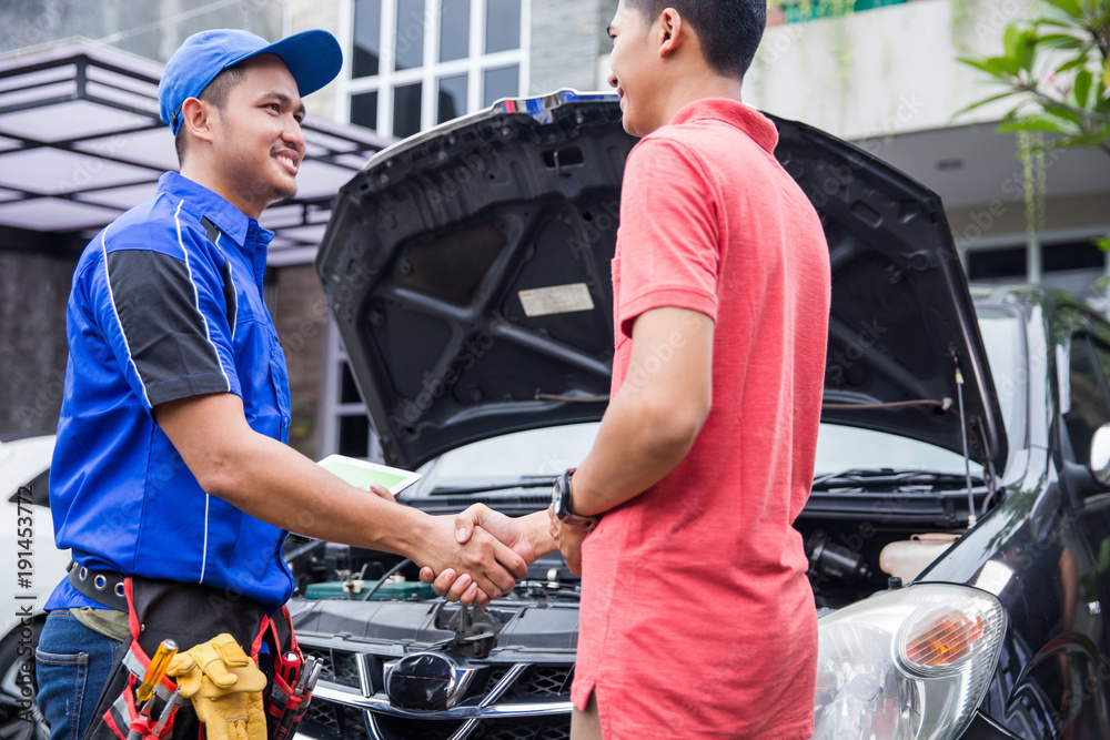 technician shake hand with customer technician shake hand with customer