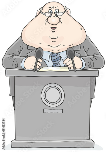 Politician standing behind a rostrum and giving a speech