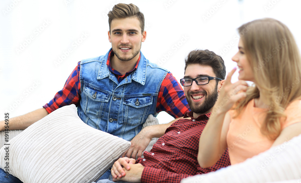group of young people going on the couch. group of young people going on the couch.