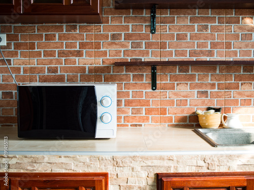 Cozy stlye kitchen are decorated with brick wall paer.