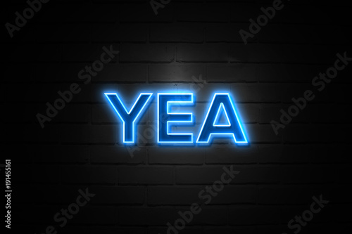 Yea neon Sign on brickwall photo
