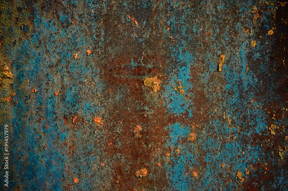 Rusty metallic surface blue paint.