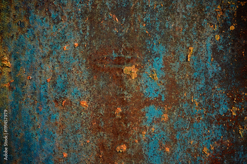 Rusty metallic surface blue paint. © denis