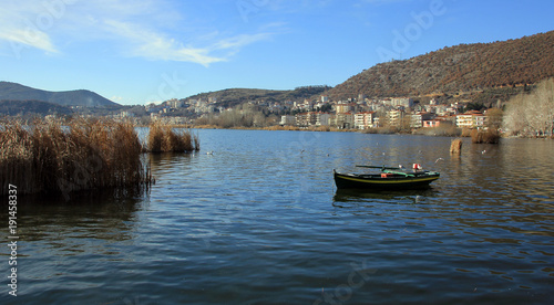 Wallpaper Mural Old wooden boat on Orestiada lake in Kastoria town, Greece Torontodigital.ca