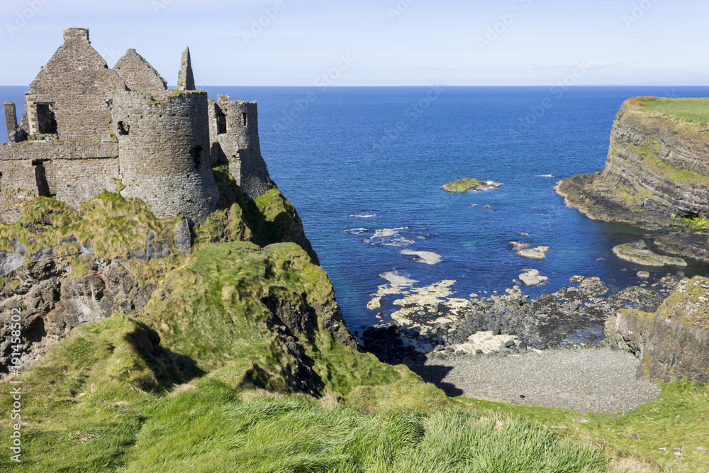 Dunluce Castle (Irish: Dun Libhse), a now-ruined medieval castle located on the edge of a basalt outcropping in County Antrim, Northern Ireland