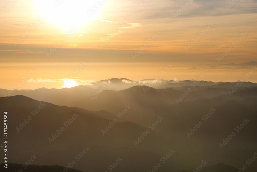 beautiful view of the sun reflected in the sea from ligurian mountains beautiful view of the sun reflected in the sea from ligurian mountains