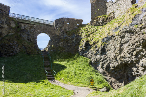 Dunluce Castle (Irish: Dun Libhse), a now-ruined medieval castle located on the edge of a basalt outcropping in County Antrim, Northern Ireland photo