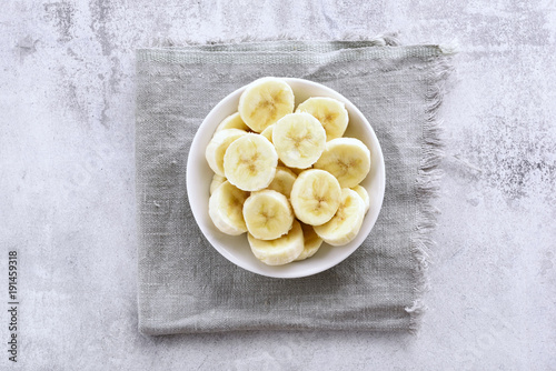 Sliced peeled banana in bowl