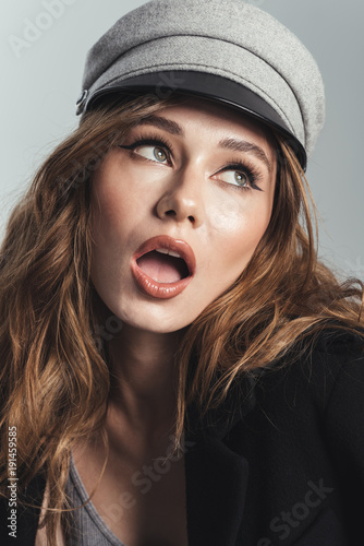 Fashion portrait of a gorgeous stylish curly brown haired woman