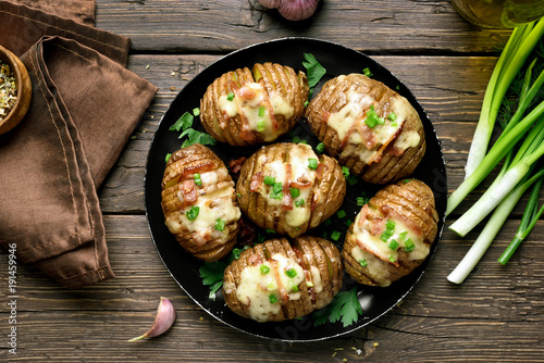 Baked stuffed potatoes with bacon, green onion and cheese