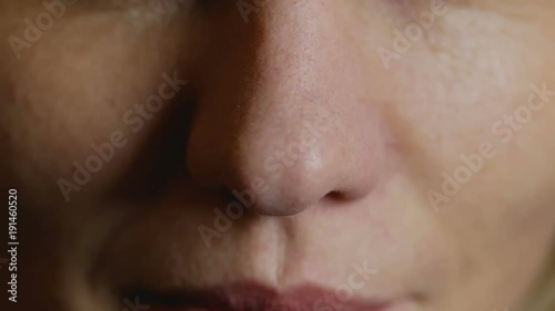 Wallpaper Mural Mature smiling lady scratches nose and then snorts. Woman is ready to sniff Torontodigital.ca