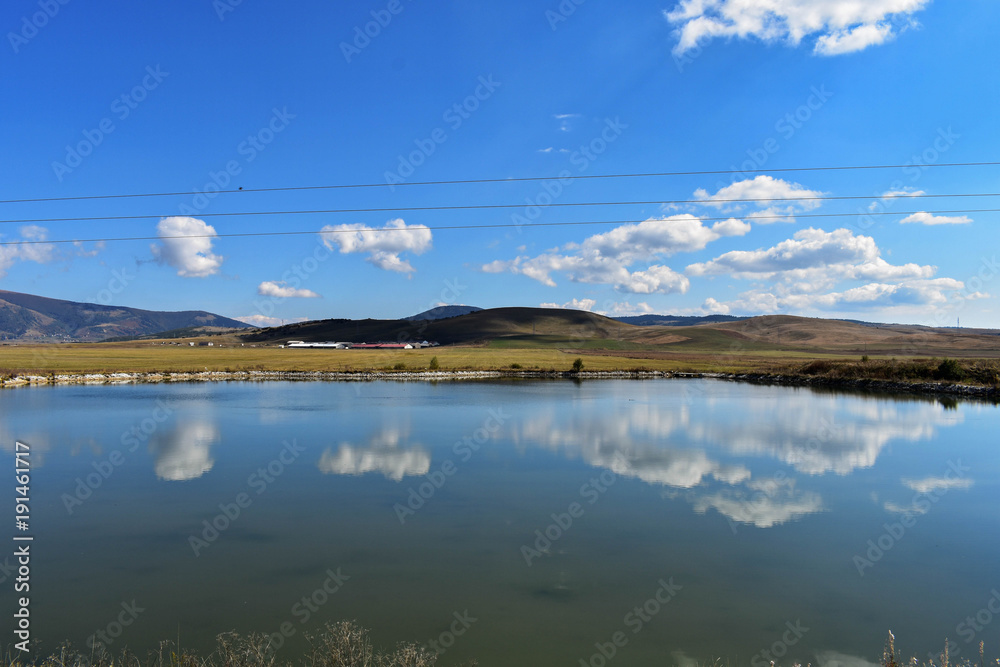 Obraz premium Clouds and sky reflection at the river/ landscape nature photography