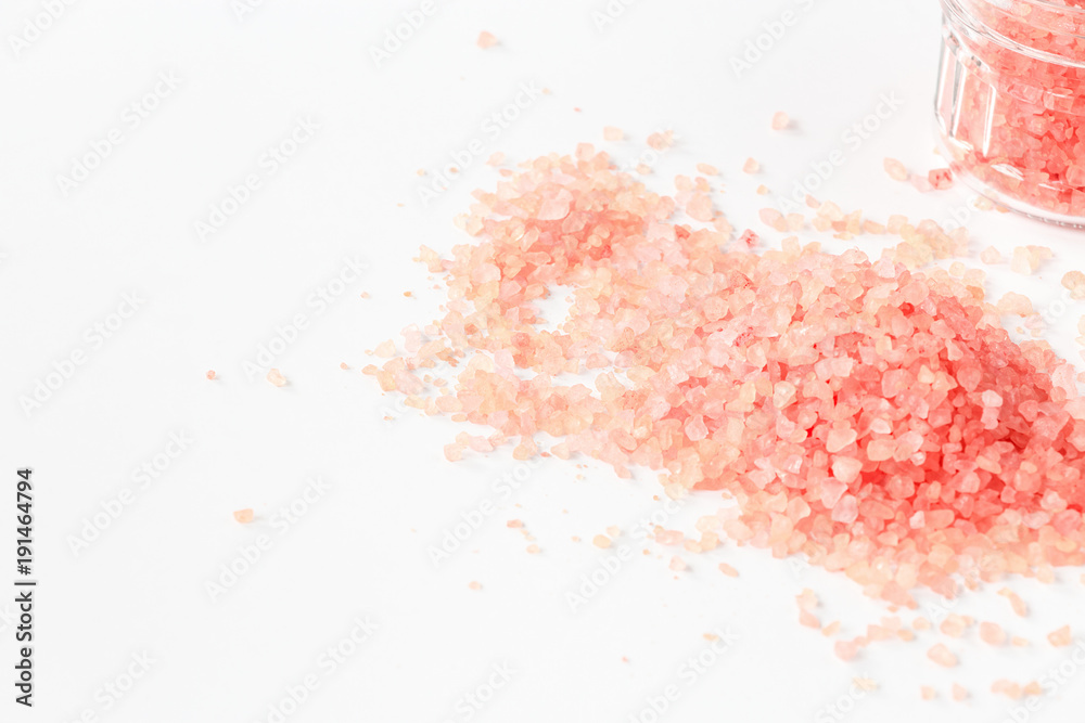 A handful of large-crystalline Himalayan pink salt. Close up. Selective focus.