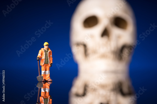 worker and blurry skull