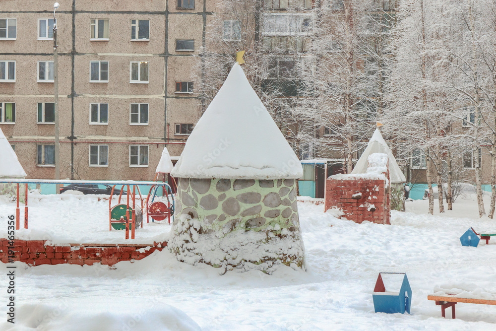 stone tower in winter in the courtyard of the sleeping area