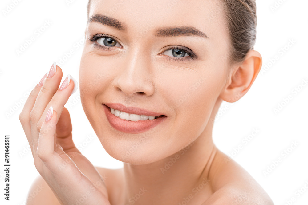 beautiful smiling girl with clean face applying cosmetic cream, isolated on white beautiful smiling girl with clean face applying cosmetic cream, isolated on white