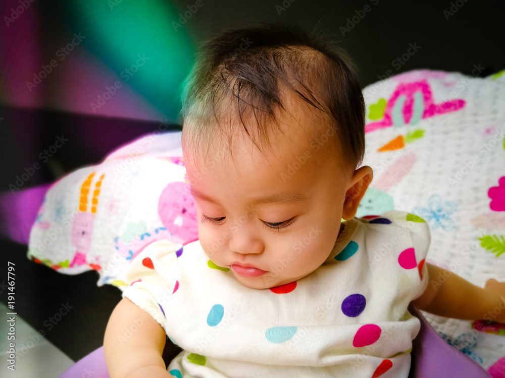 Candid portrait of a cute and expressive Asian baby girl. Lifestyle and childhood concept. Candid portrait of a cute and expressive Asian baby girl. Lifestyle and childhood concept.