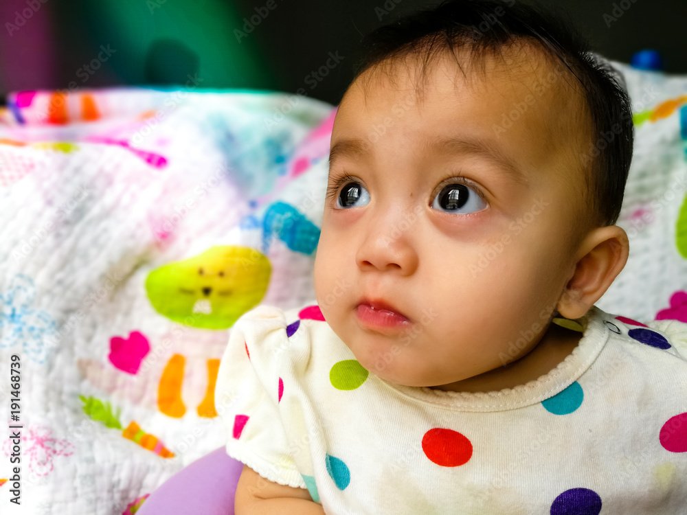 Candid portrait of a cute and expressive Asian baby girl. Lifestyle and childhood concept. Candid portrait of a cute and expressive Asian baby girl. Lifestyle and childhood concept.