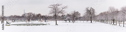 A panoramic view of a park in Paris under the snow