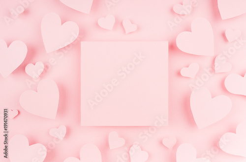 Blank pink square page with paper hearts on light background. Advertesign concept for Valentine day. © finepoints