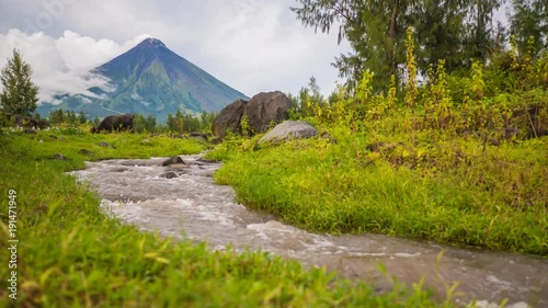 Foothills of the Mayon Volcano with flowing mountain rivers near Legazpi city in Philippines. Mayon Volcano is an active volcano and 2462 meters high. photo