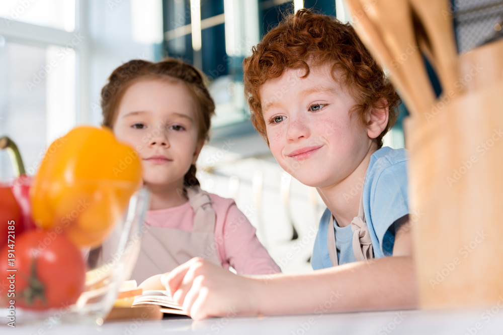 selective focus of cute little kids cooking together in kitchen selective focus of cute little kids cooking together in kitchen