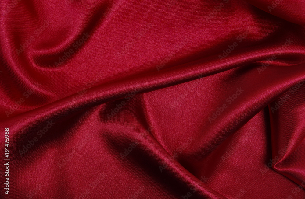 Obraz premium Smooth elegant red silk or satin luxury cloth texture as abstract background. Luxurious valentines day background design