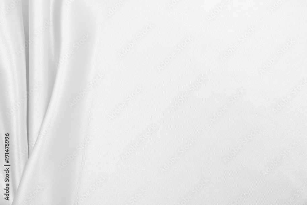 Obraz premium Smooth elegant white silk or satin luxury cloth texture as wedding background. Luxurious Christmas background or New Year background design
