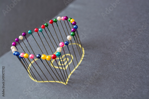 Heart shape from colored pins.