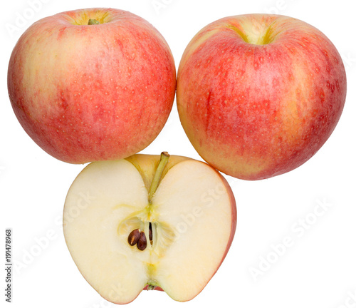 Apples on a white background, two whole and one half