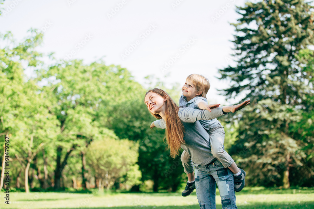 Fototapeta premium happy mother and son playing in the Park