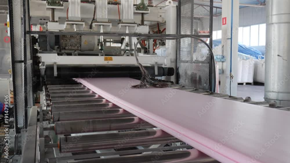 industry, production of styrofoam moving on conveyor line on factory ...