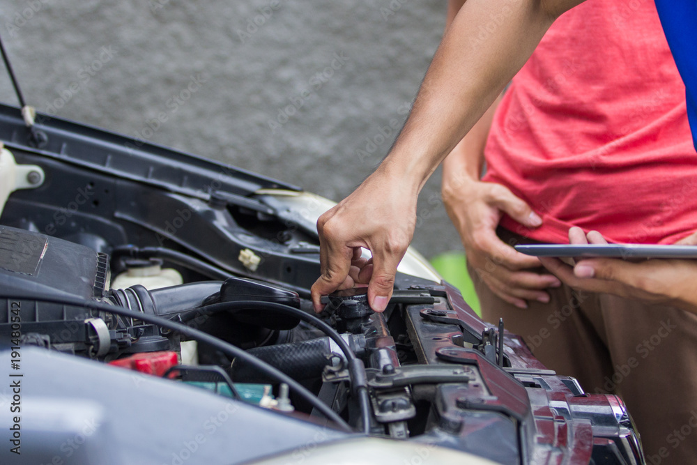 technician checking carburetor technician checking carburetor