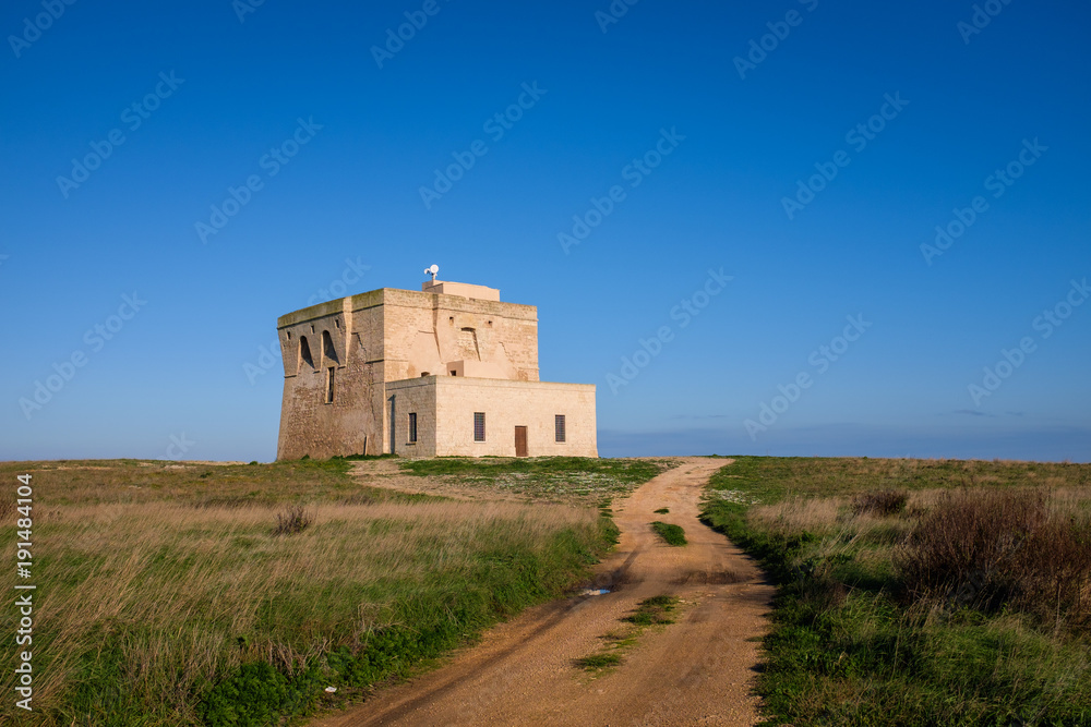 XVI Century antique defensive tower Torre Guaceto along the coast of Apulia. Italy