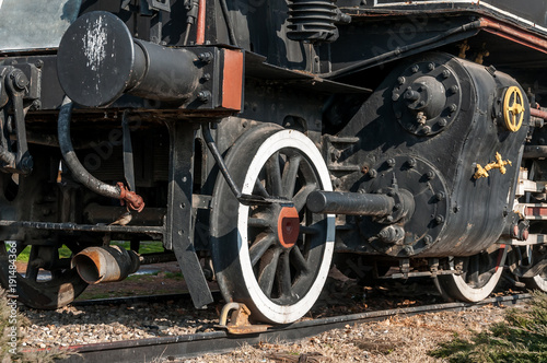 Steam train locomotive close up on wheels and pressure gauge