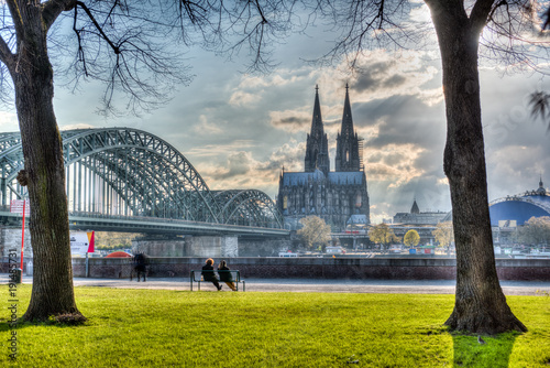 Der Kölner Dom und die Hohenzoller Brücke am Rhein photo