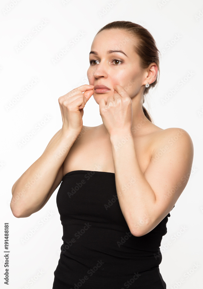 gymnastics for a face, woman doing anti-aging exercises. beauty and health concept gymnastics for a face, woman doing anti-aging exercises. beauty and health concept