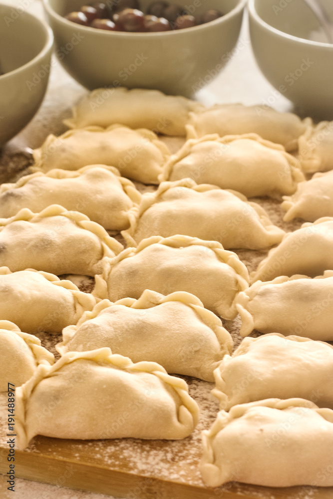 The process of cooking dumplings with cherries. Tasty Ukrainian The process of cooking dumplings with cherries. Tasty Ukrainian