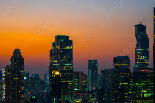 Silhouette of Skyscraper Cityscape at Twilight Time in Bangkok, Thailand.
