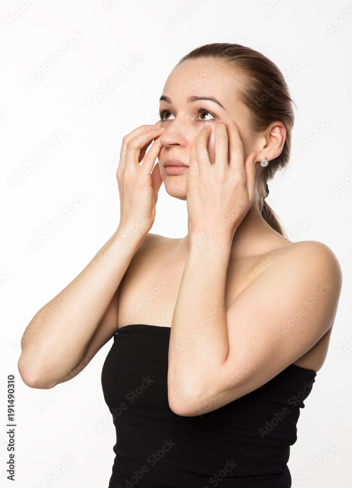 prevention of skin aging, woman performs exercises for a face building. beauty and health concept prevention of skin aging, woman performs exercises for a face building. beauty and health concept