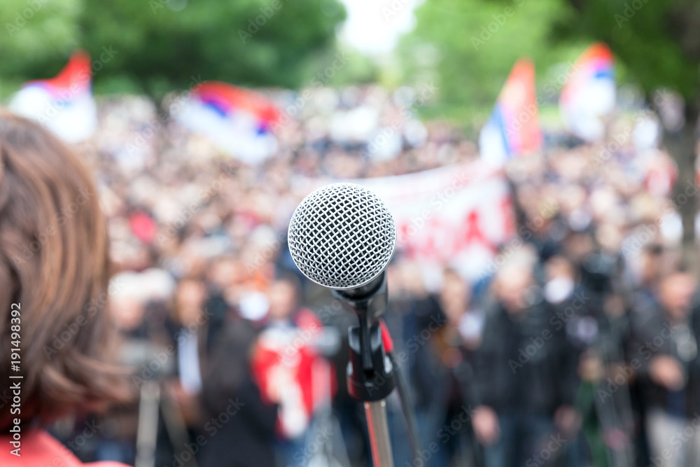 Political protest. Demonstration. Microphone in focus against blurred crowd. Political protest. Demonstration. Microphone in focus against blurred crowd.