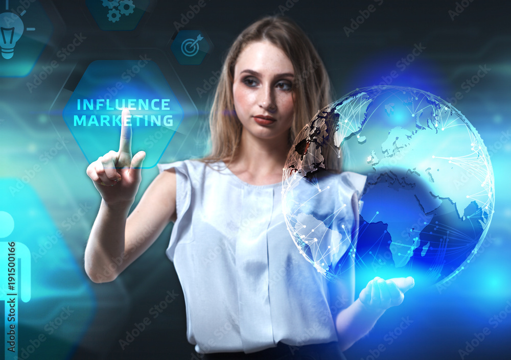 The concept of business, technology, the Internet and the network. A young entrepreneur working on a virtual screen of the future and sees the inscription: Influence marketing The concept of business, technology, the Internet and the network. A young entrepreneur working on a virtual screen of the future and sees the inscription: Influence marketing