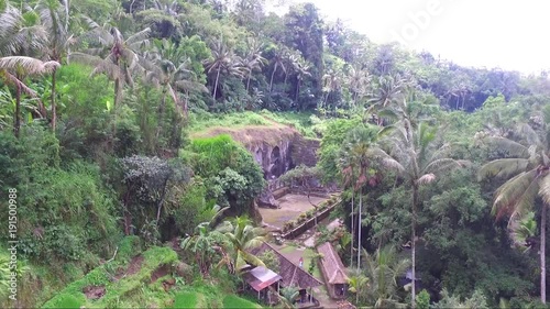 Rising drone shot of iconic gunung Kawi temple complex in Indonesia photo