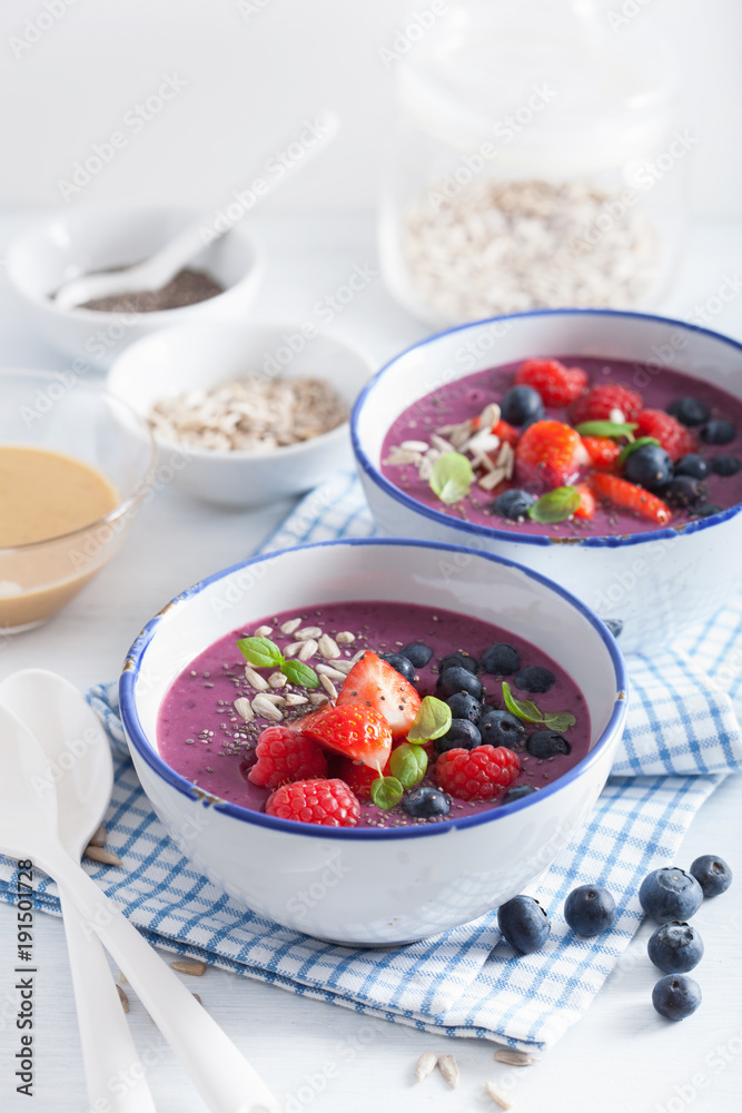 healthy berry smoothie bowl with strawberry blueberry raspberry and chia seed