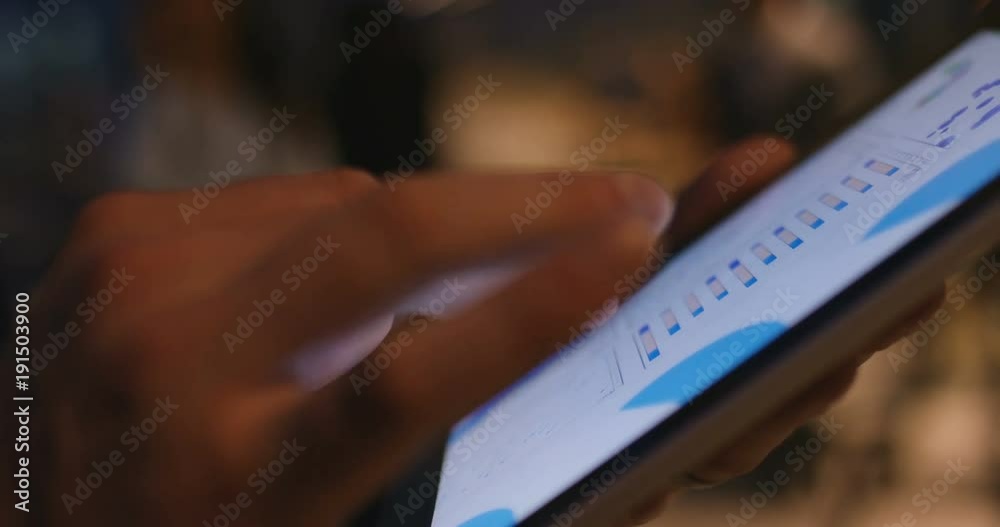 4k, Closeup of fingers swiping through financial charts. Slow motion.