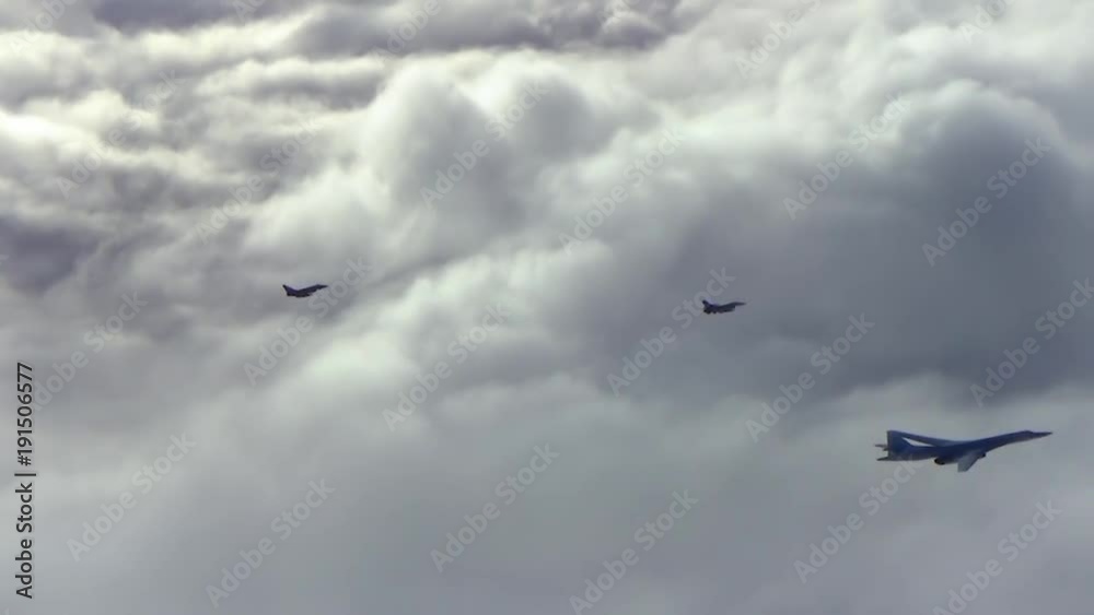 Two fighter planes fly over bomber Two fighter planes fly over bomber
