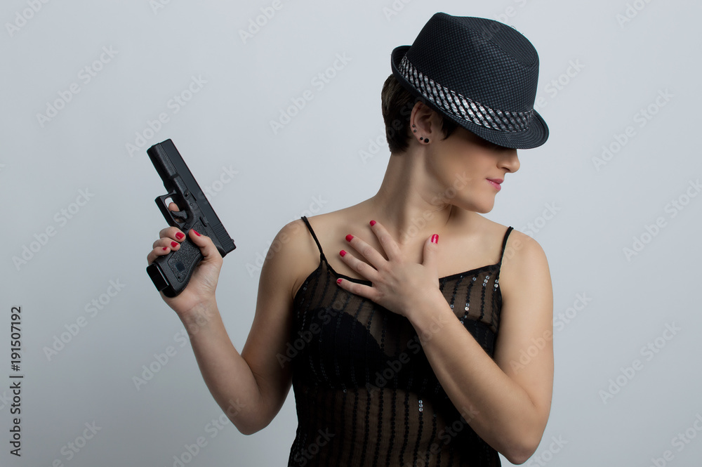 Woman with gun and hat Woman with gun and hat